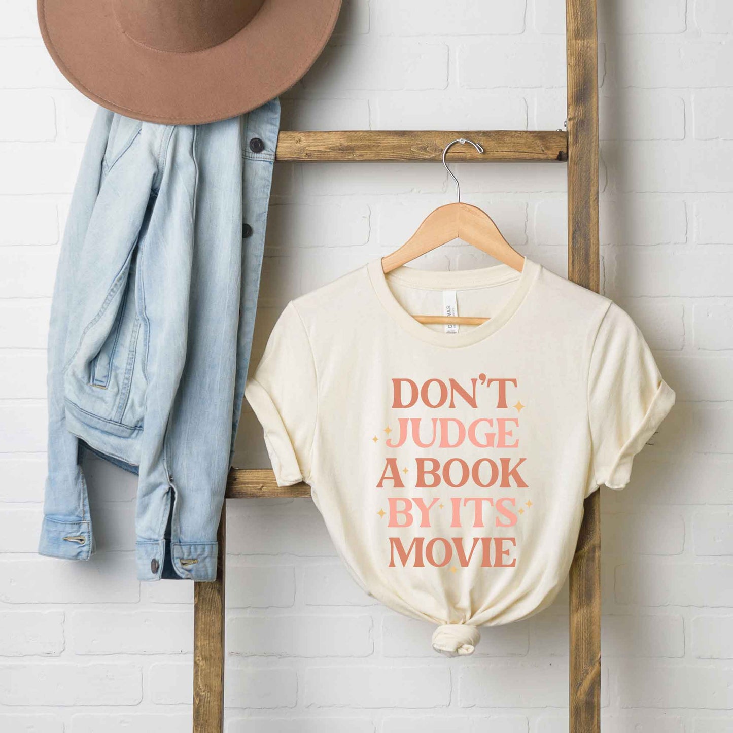 Don't Judge A Book By It's Movie | Short Sleeve Graphic Tee