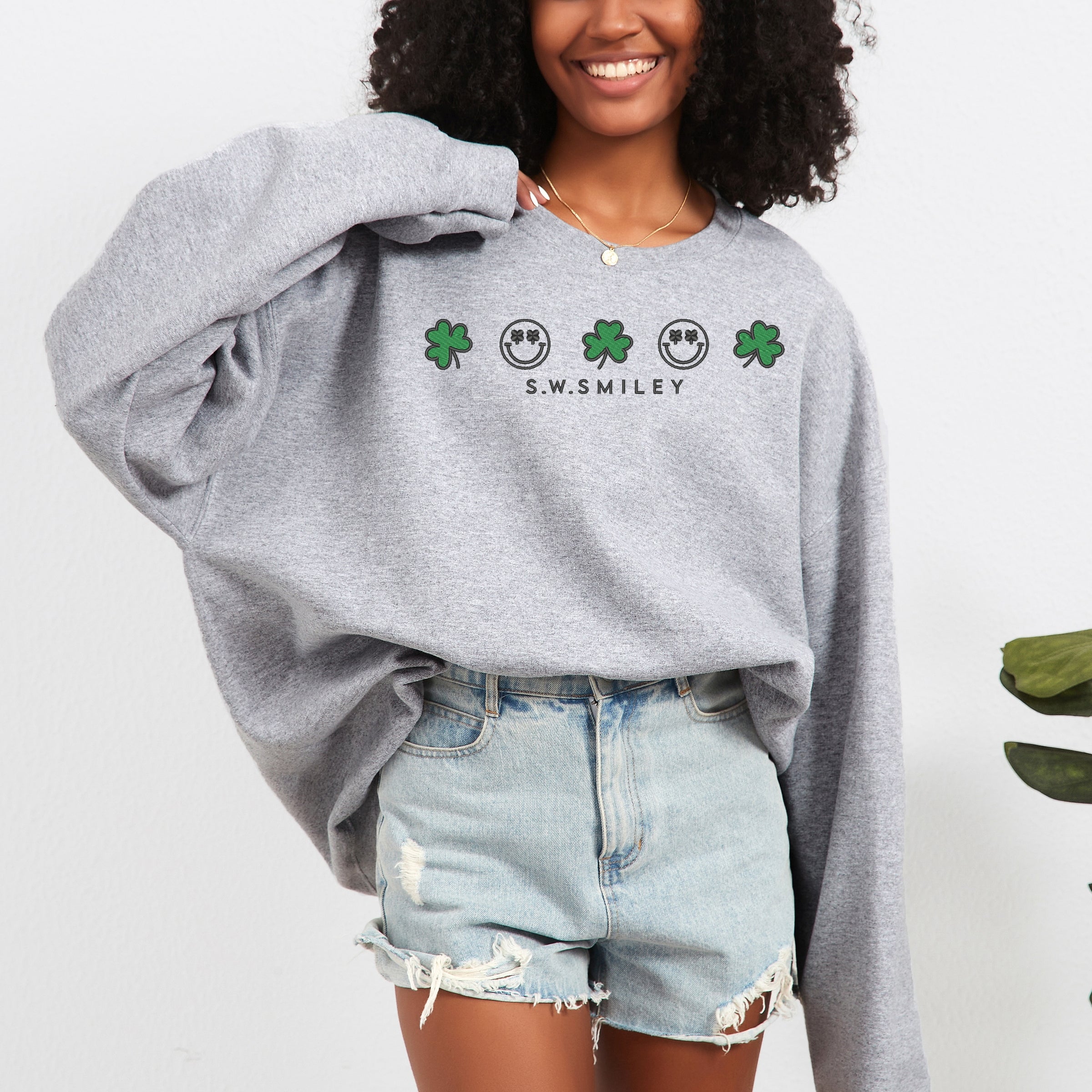 Embroidered S.W. Smiley Clovers Row - Women's Graphic Sweatshirt