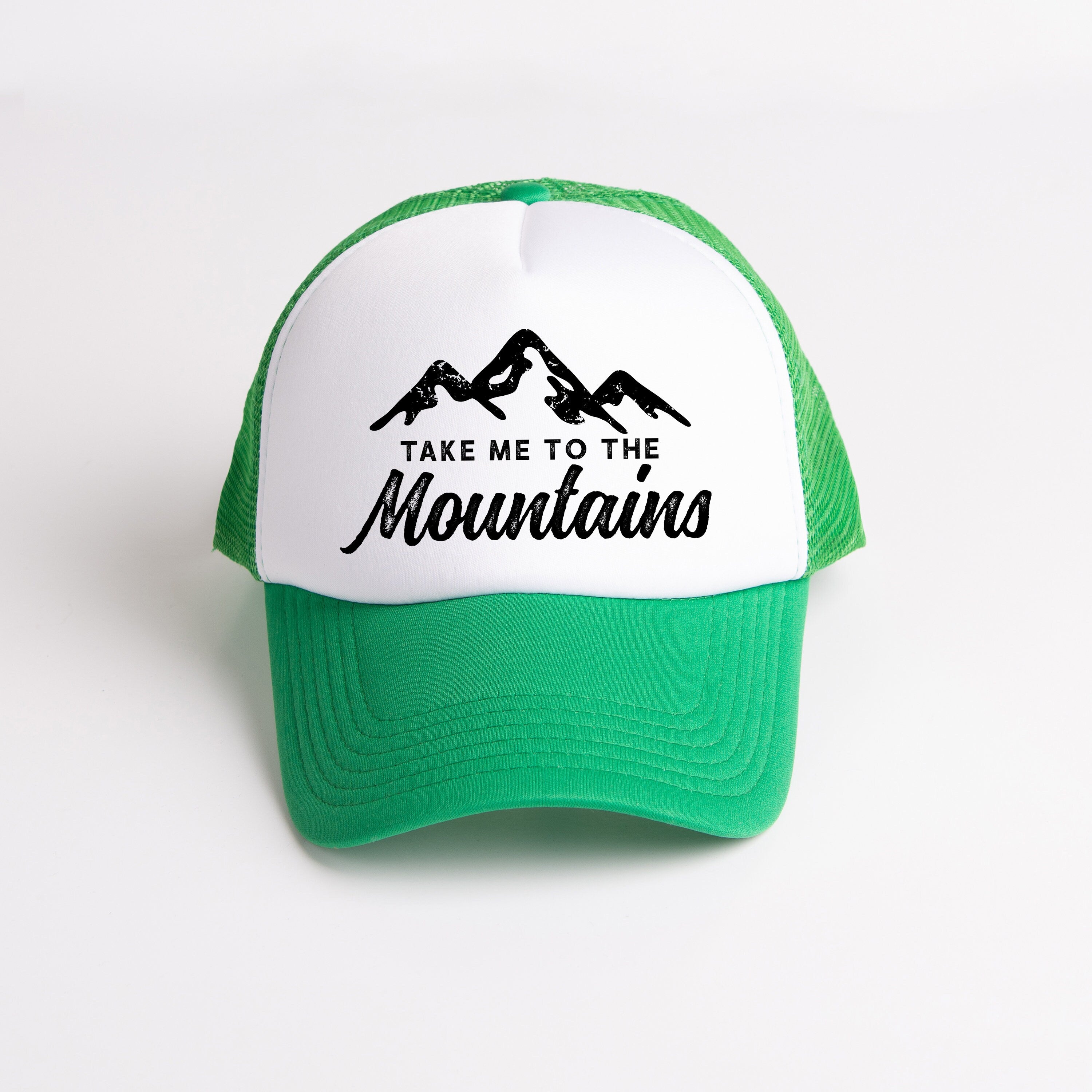 a green and white hat that says take me to the mountains