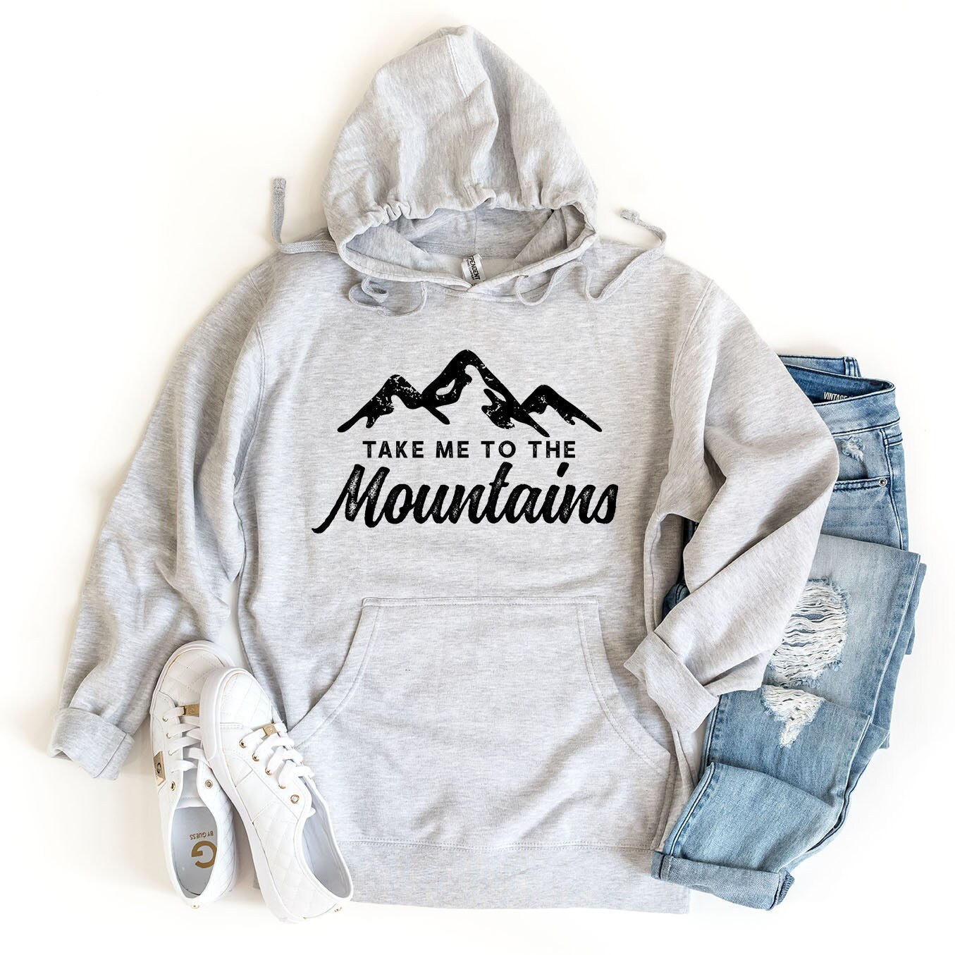 a sweatshirt that says take me to the mountains