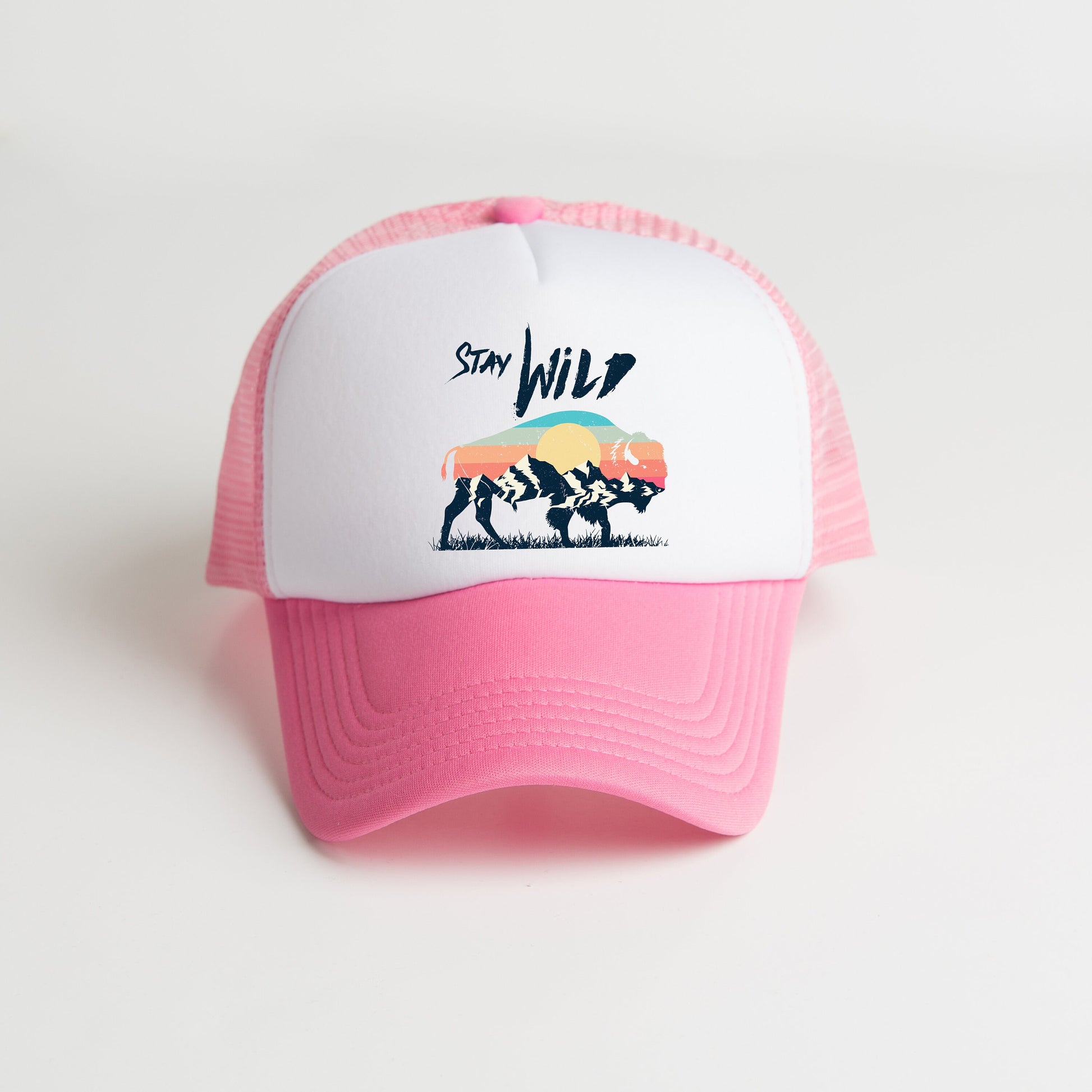 a pink and white trucker hat with a picture of a bison
