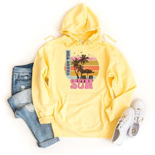 a yellow sweatshirt with a palm tree on it