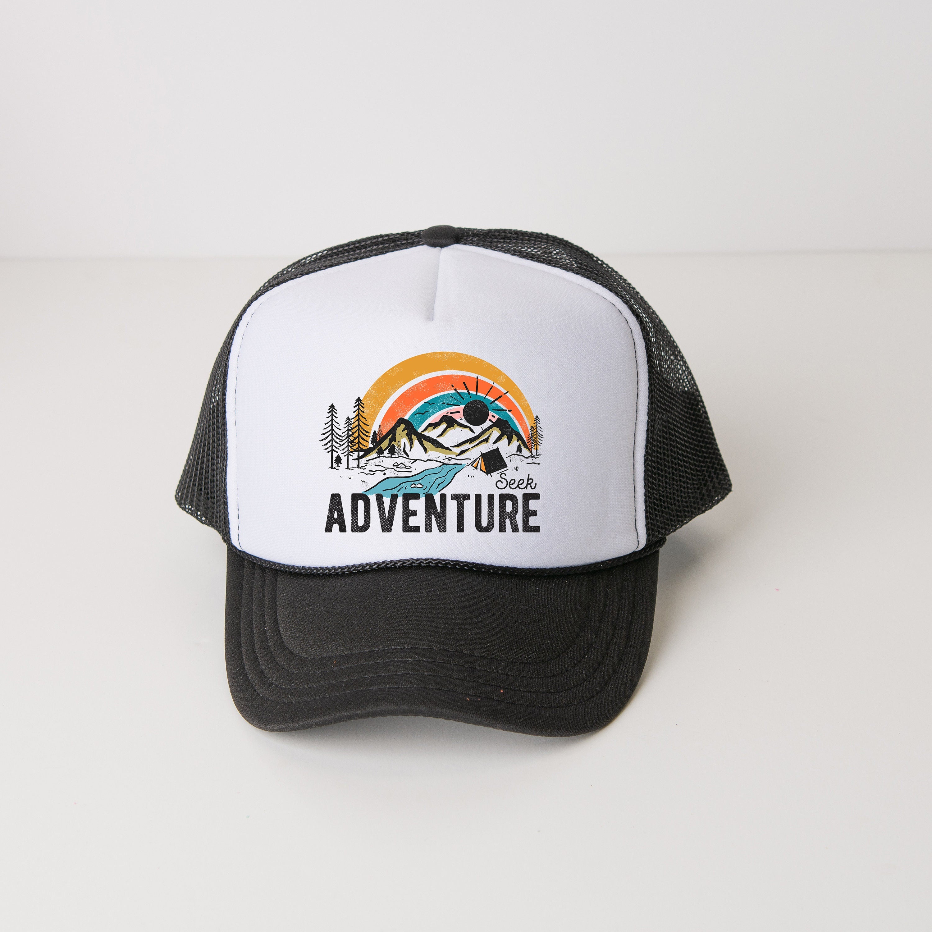 a black and white hat with the words adventure on it