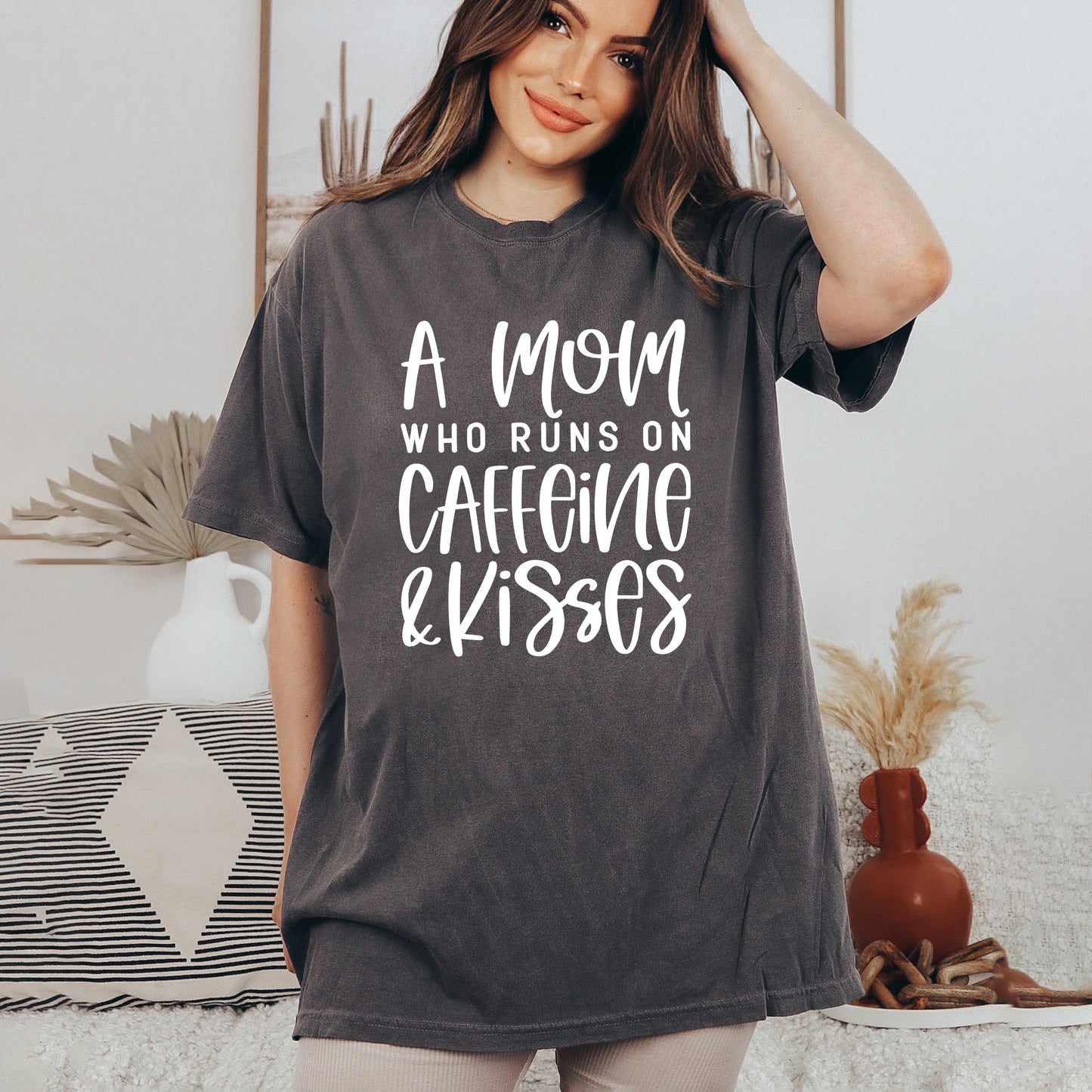 A Mom Who Runs On Caffeine And Kisses | Garment Dyed Short Sleeve Tee