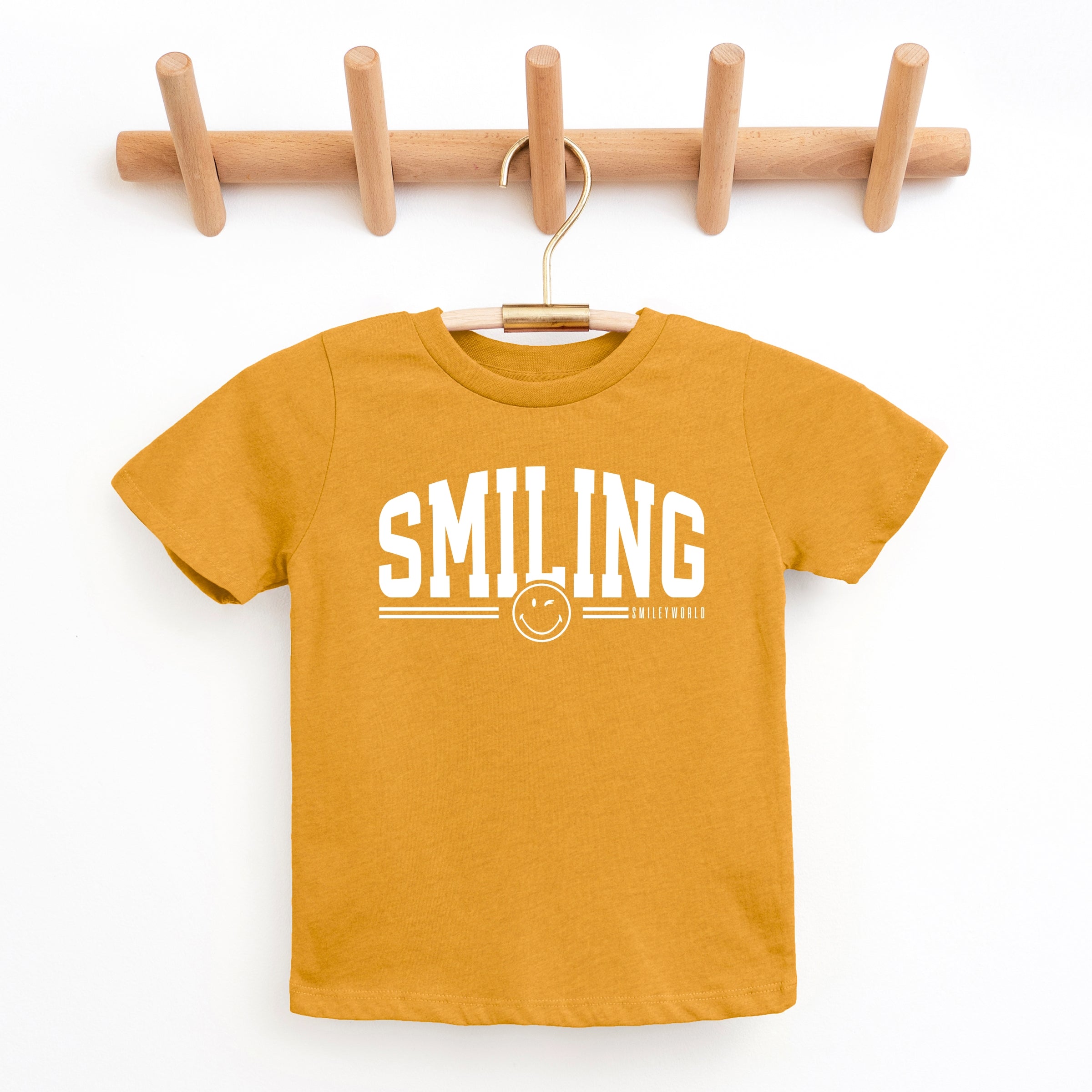 SmileyWorld Arched Varsity - Youth Short Sleeve Graphic T-Shirt