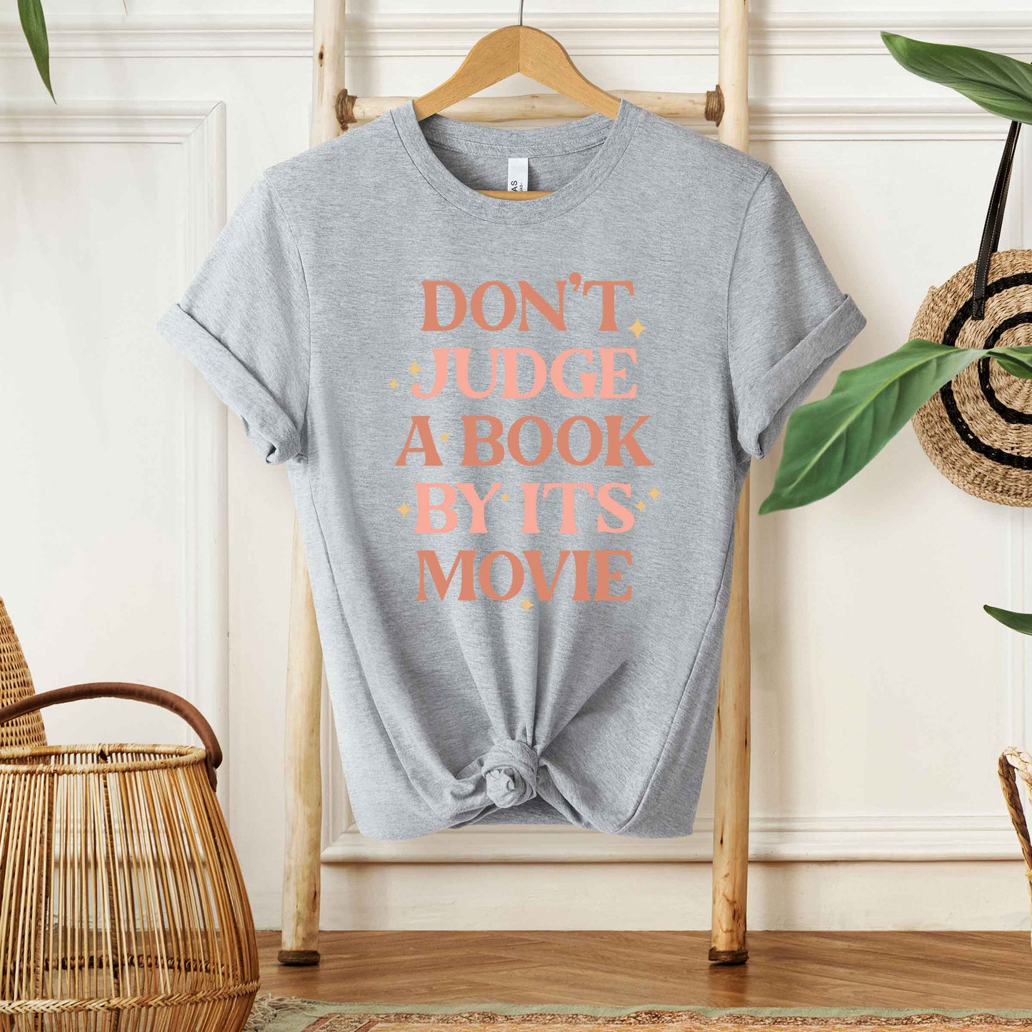 Don't Judge A Book By It's Movie | Short Sleeve Graphic Tee