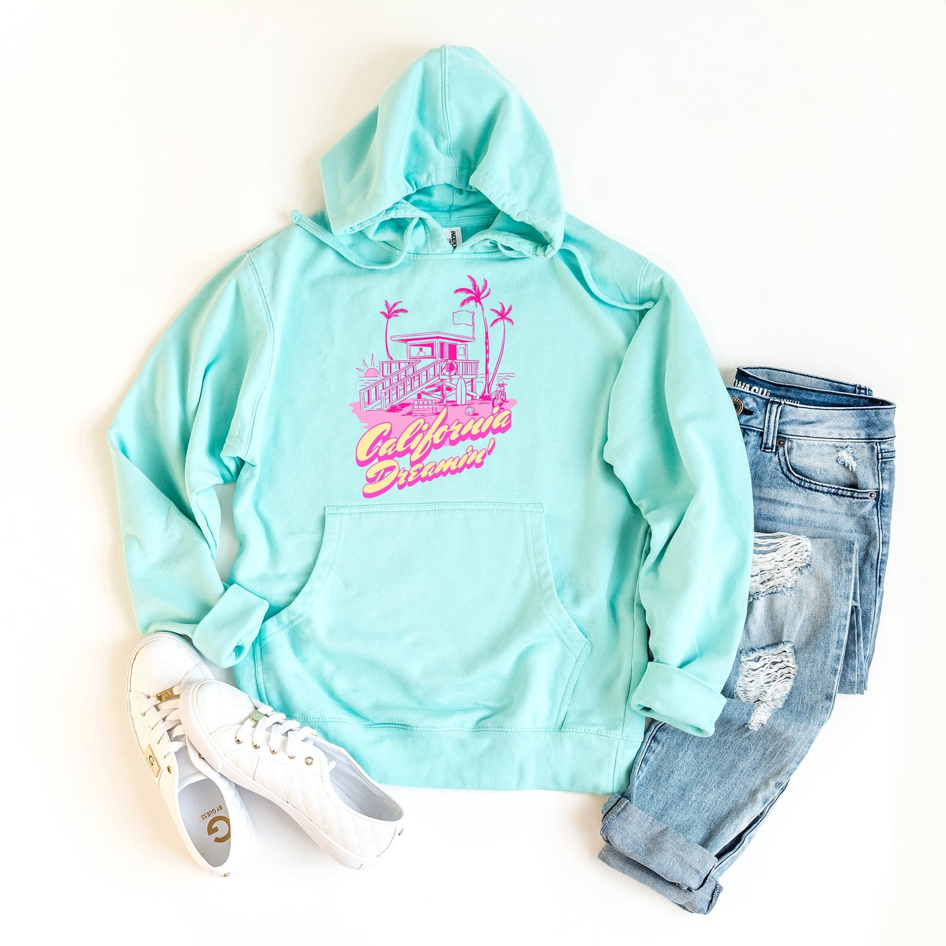 a turquoise hoodie with the words california printed on it