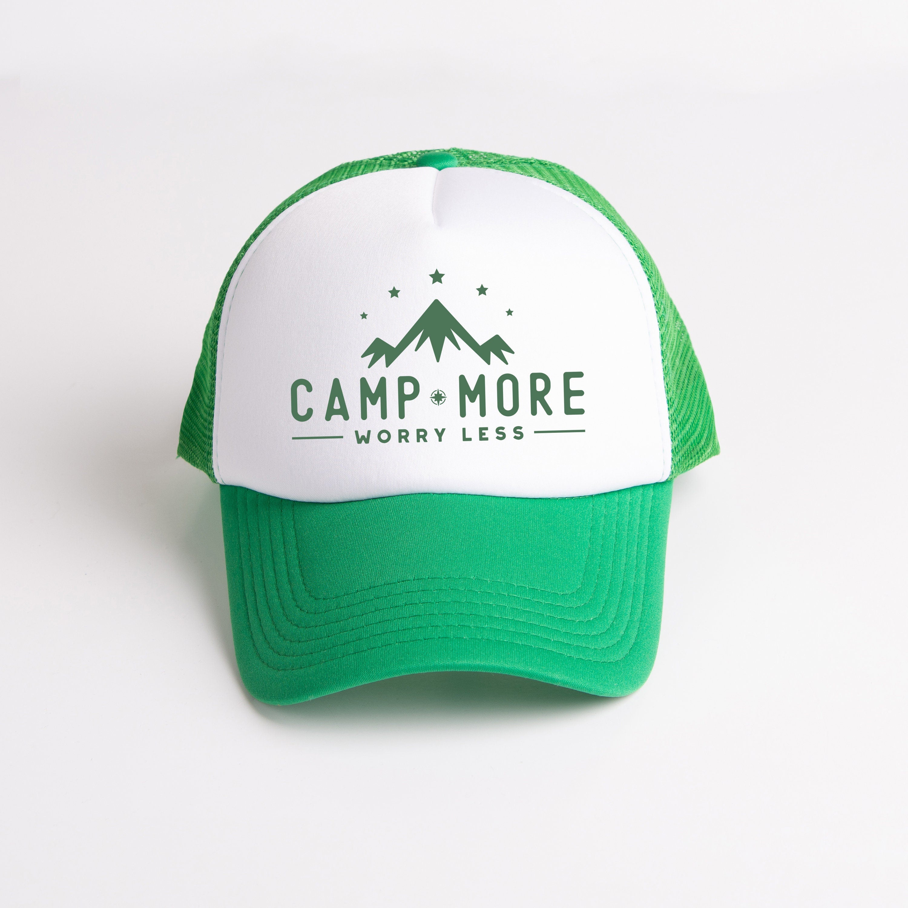 a green and white trucker hat that says camp more worry less