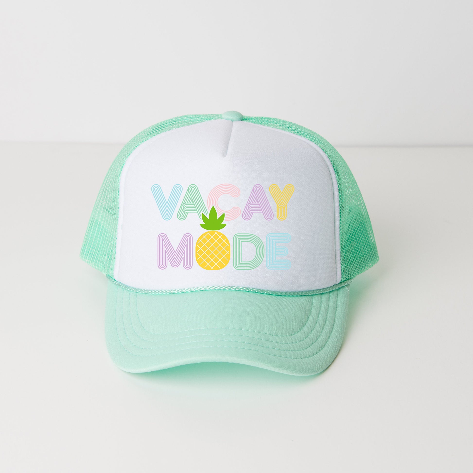 a green and white trucker hat that says vacay mode
