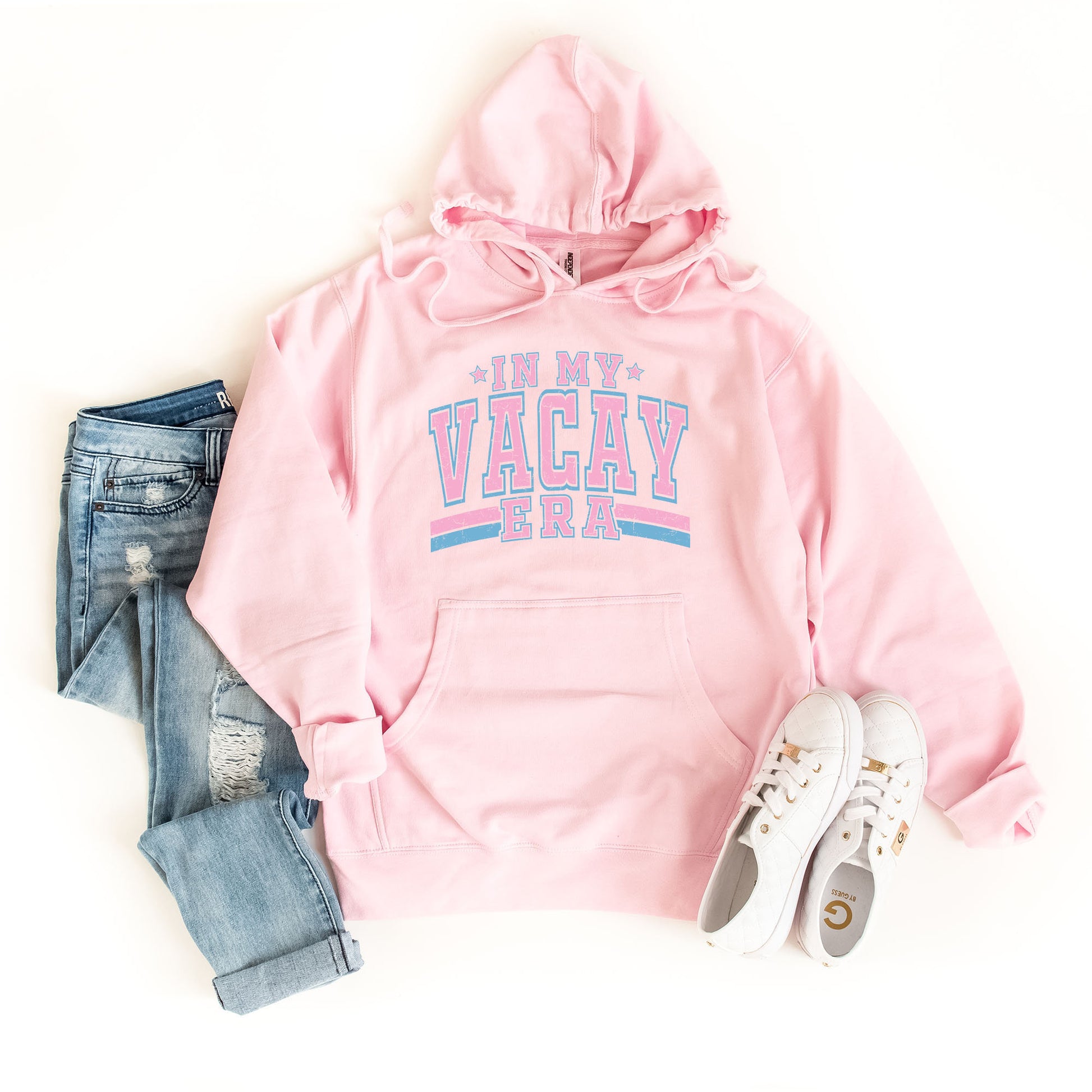 a pink hoodie with a pair of jeans and sneakers