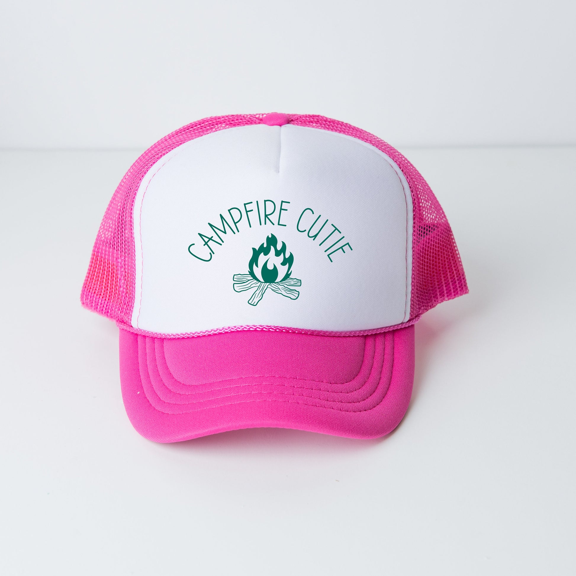 a pink and white trucker hat with a campfire logo