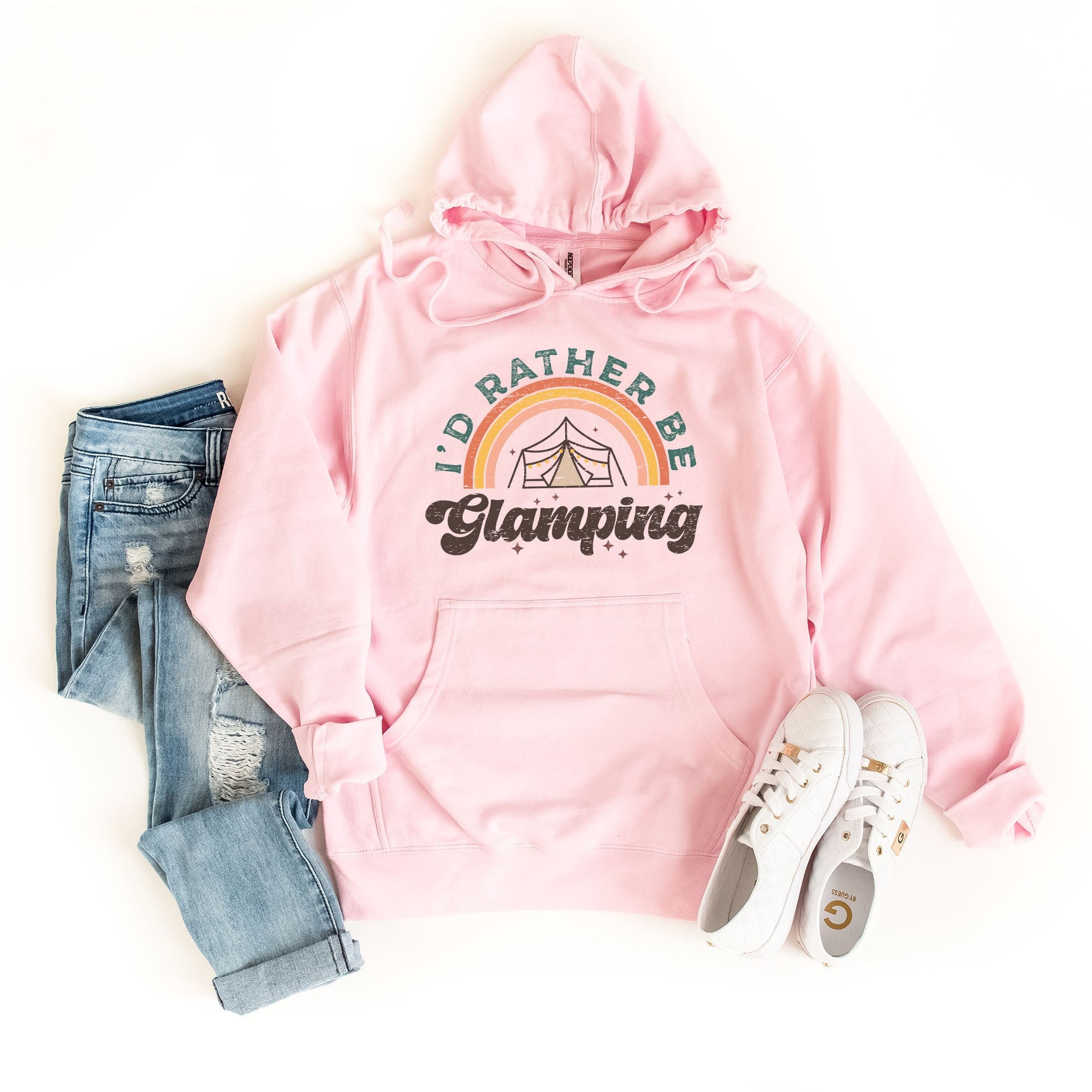 a pink hoodie, jeans, and sneakers on a white background